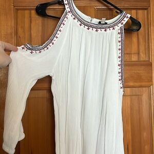 White shoulder cut out top